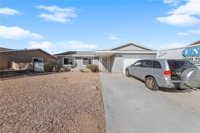 ranch-style house featuring a garage