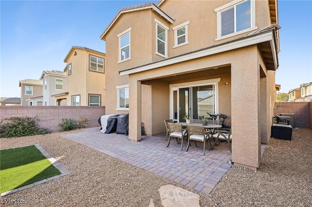 back of house featuring a patio area