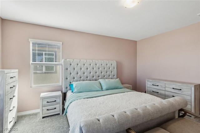 bedroom with light colored carpet