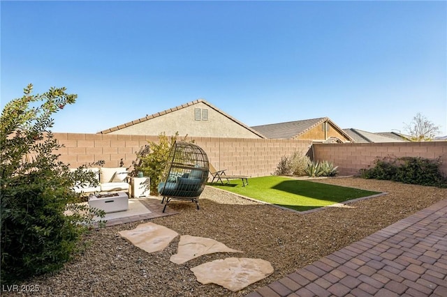 view of yard with an outdoor living space and a patio