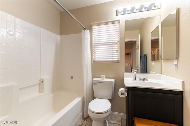 full bathroom featuring shower / bath combo, vanity, toilet, and baseboards