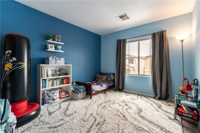 rec room with carpet, visible vents, and baseboards