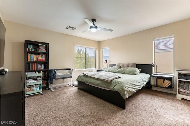 bedroom with baseboards, visible vents, and carpet flooring