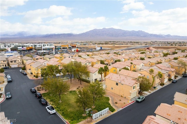 bird's eye view with a residential view and a mountain view