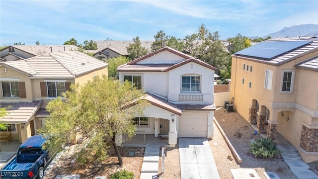 9527 Havasu Canyon Ave, Las Vegas, NV 89166 - view of front of home featuring an attached garage, concrete driveway, stucco siding, cooling unit, and a tiled roof