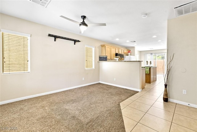 9527 Havasu Canyon Ave, Las Vegas, NV 89166 - unfurnished living room with baseboards, ceiling fan, recessed lighting, light colored carpet, and light tile patterned floors