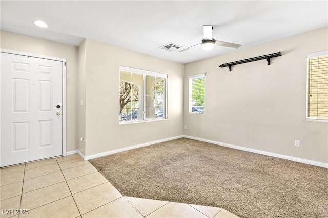9527 Havasu Canyon Ave, Las Vegas, NV 89166 - foyer featuring a ceiling fan, light carpet, baseboards, and light tile patterned floors