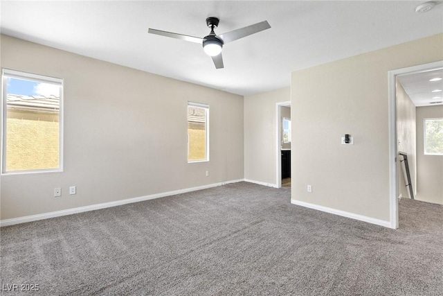9527 Havasu Canyon Ave, Las Vegas, NV 89166 - carpeted spare room with a smoke detector, baseboards, and a ceiling fan