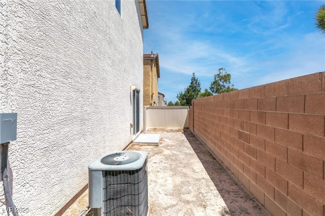 9527 Havasu Canyon Ave, Las Vegas, NV 89166 - view of side of property featuring central air condition unit and stucco siding