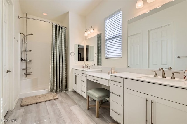 bathroom featuring vanity, hardwood / wood-style flooring, and walk in shower