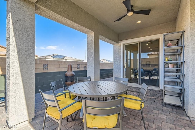 view of patio / terrace featuring ceiling fan