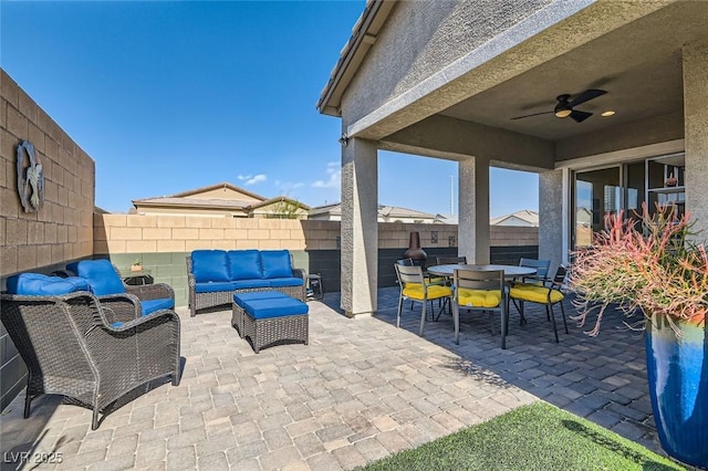 view of patio / terrace with an outdoor living space and ceiling fan