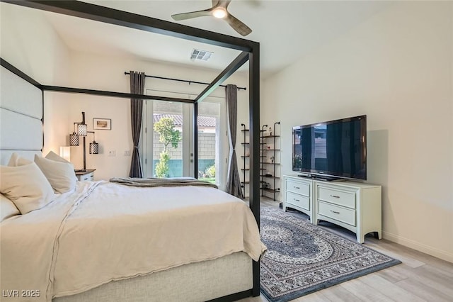 bedroom with ceiling fan, access to exterior, and light hardwood / wood-style floors