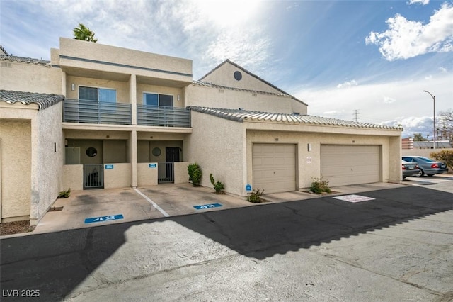 multi unit property featuring a garage