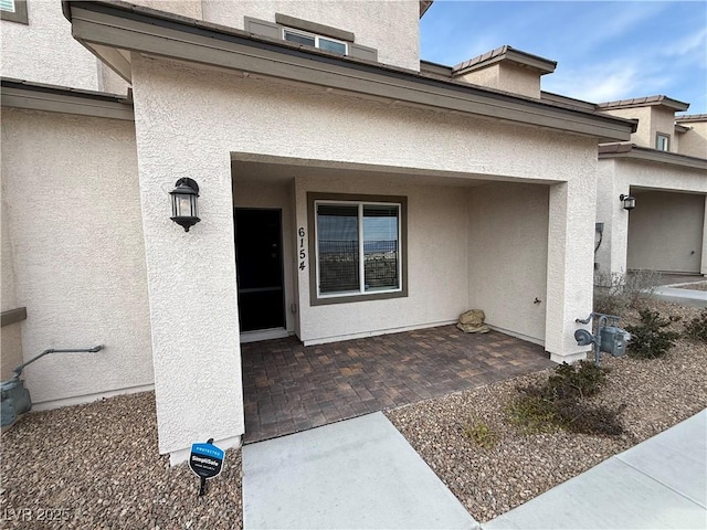 doorway to property featuring a patio