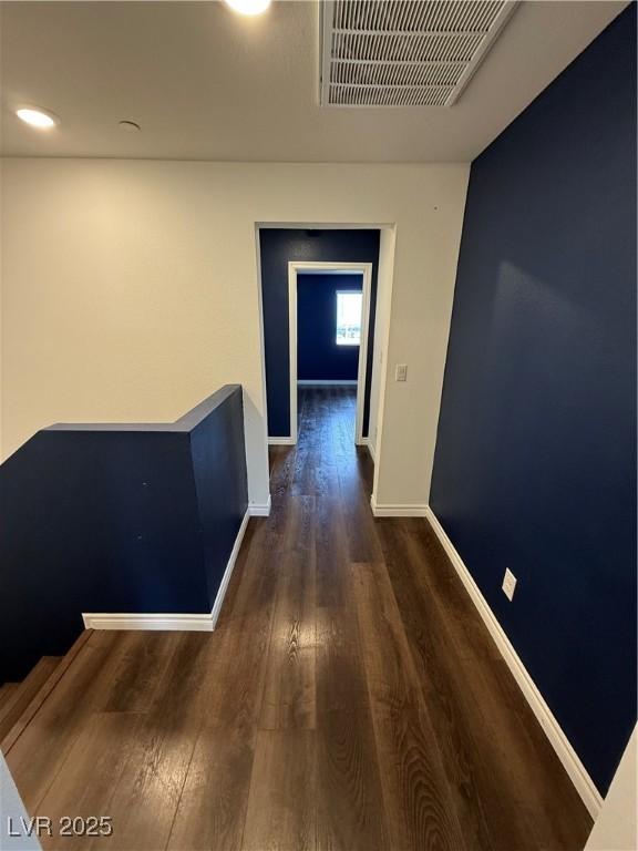 corridor featuring dark hardwood / wood-style flooring