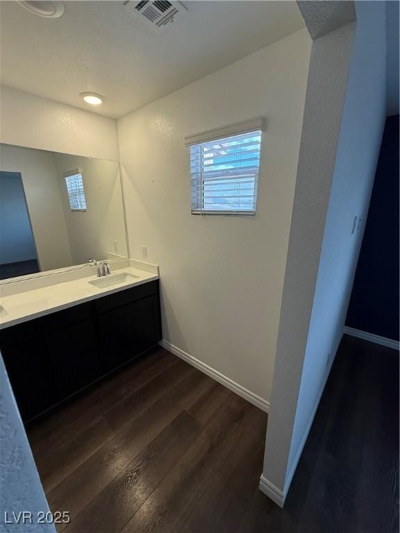 bathroom with wood-type flooring and vanity