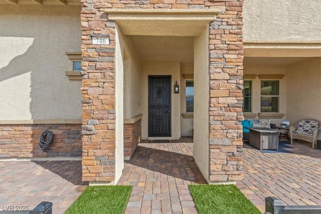 entrance to property with a patio area