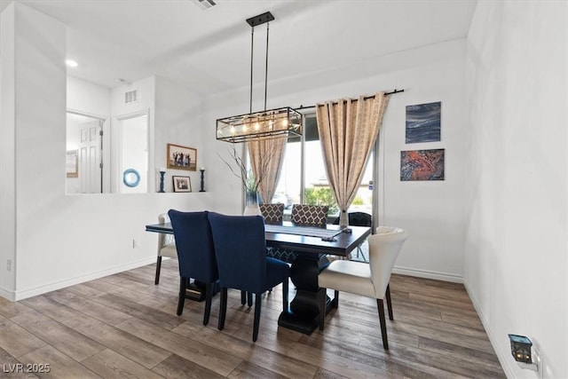 dining area featuring hardwood / wood-style floors