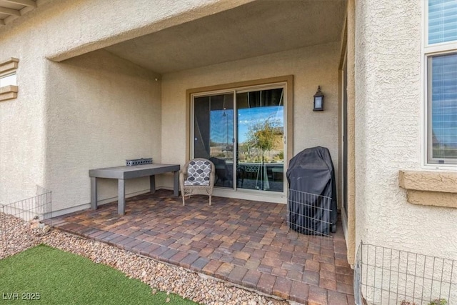 view of patio with a grill