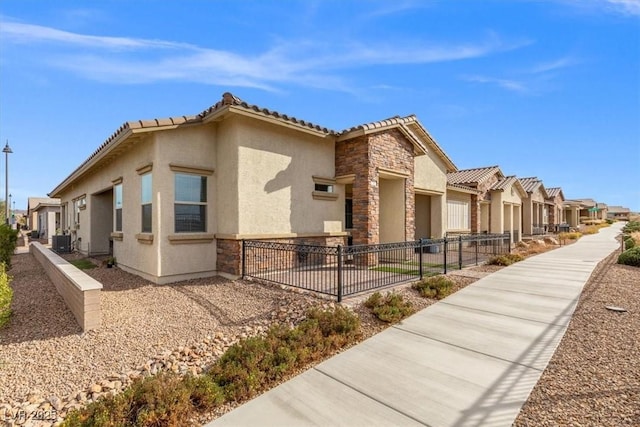 view of property exterior featuring a garage and cooling unit