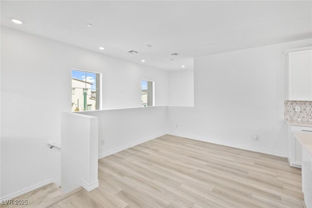 spare room featuring light hardwood / wood-style flooring