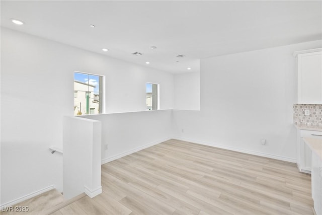 unfurnished room featuring light hardwood / wood-style flooring