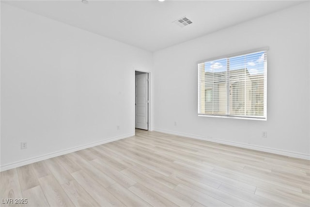 unfurnished room featuring light hardwood / wood-style flooring