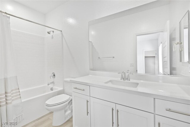 full bathroom featuring hardwood / wood-style flooring, vanity, shower / tub combo with curtain, and toilet