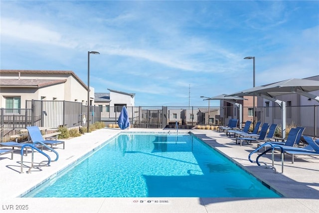 view of swimming pool with a patio area