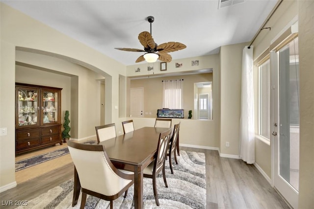 dining room featuring light hardwood / wood-style floors and ceiling fan