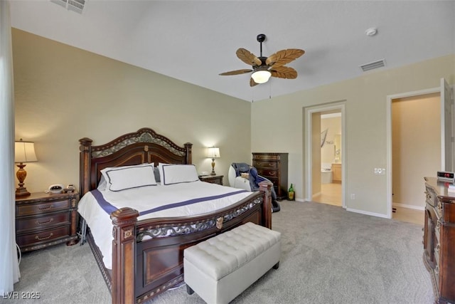 bedroom featuring light carpet, connected bathroom, and ceiling fan