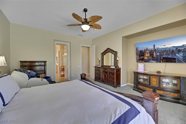 carpeted bedroom with ceiling fan and ensuite bathroom