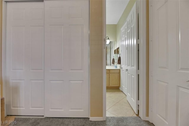 unfurnished bedroom with a closet and light tile patterned flooring