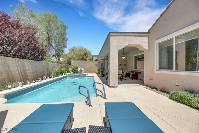 view of pool with a patio and ceiling fan