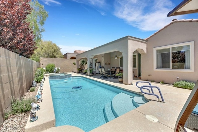 view of swimming pool featuring an in ground hot tub, ceiling fan, and a patio area