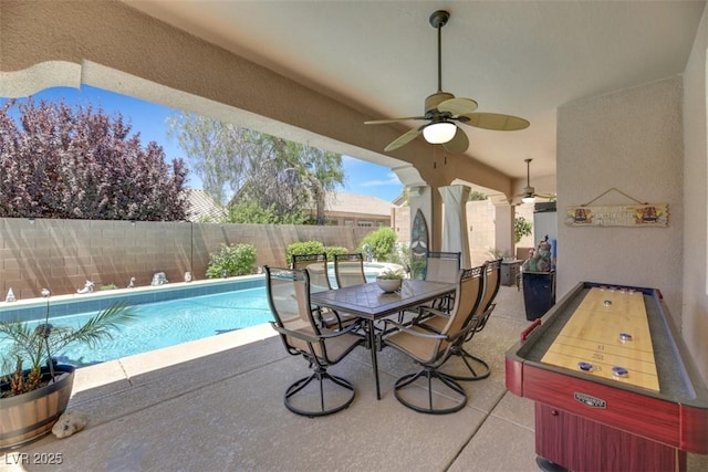 view of swimming pool with a patio area and ceiling fan