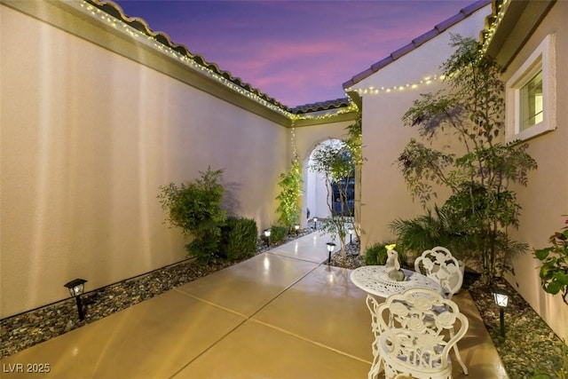 view of patio terrace at dusk