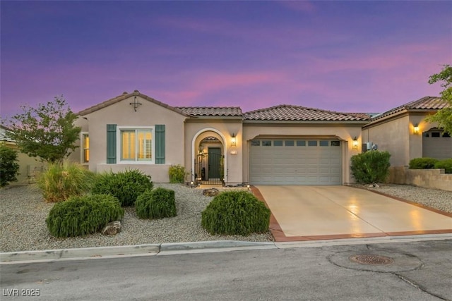 mediterranean / spanish-style house featuring a garage