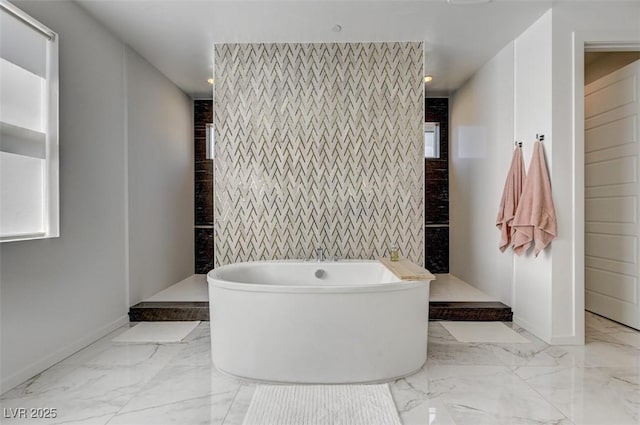 bathroom with recessed lighting, baseboards, a freestanding bath, marble finish floor, and walk in shower