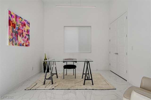 office with marble finish floor and baseboards