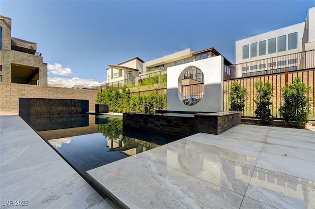 view of patio / terrace featuring fence