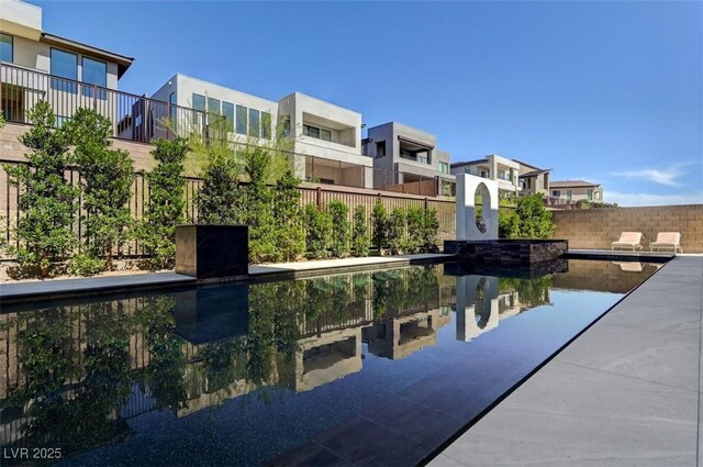 view of pool with fence