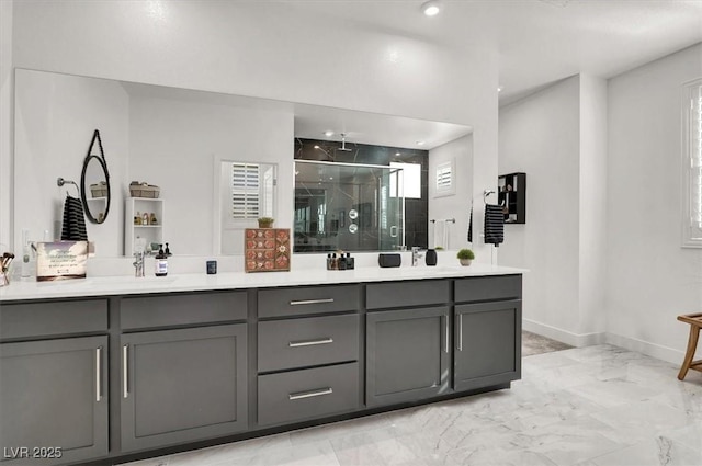 bathroom featuring walk in shower and vanity