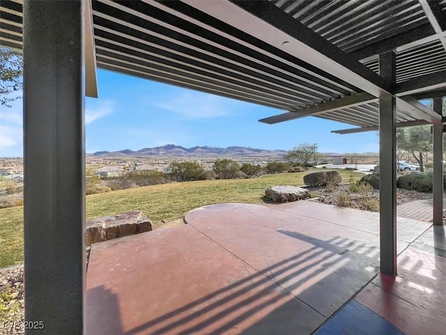 view of patio with a mountain view and a pergola