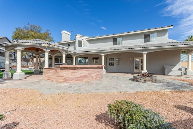 back of house with a patio area