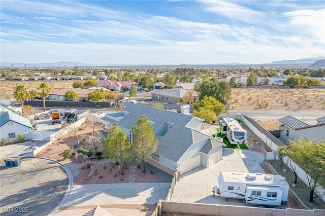 birds eye view of property with a mountain view