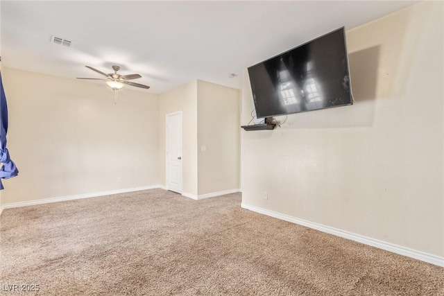 empty room with carpet floors and ceiling fan