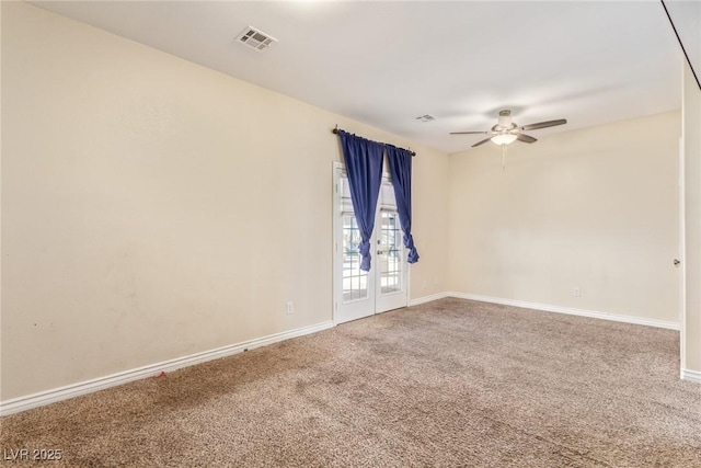 carpeted empty room featuring ceiling fan