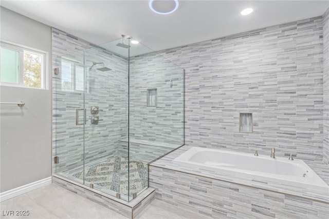 bathroom featuring shower with separate bathtub and tile patterned floors